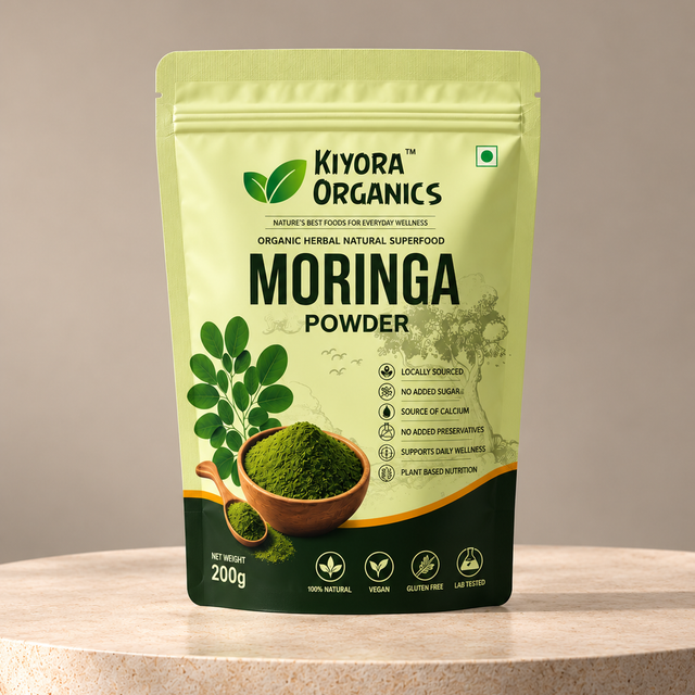 Kiyora Organics Moringa Leaf Powder pouch, 200g, on a stone pedestal